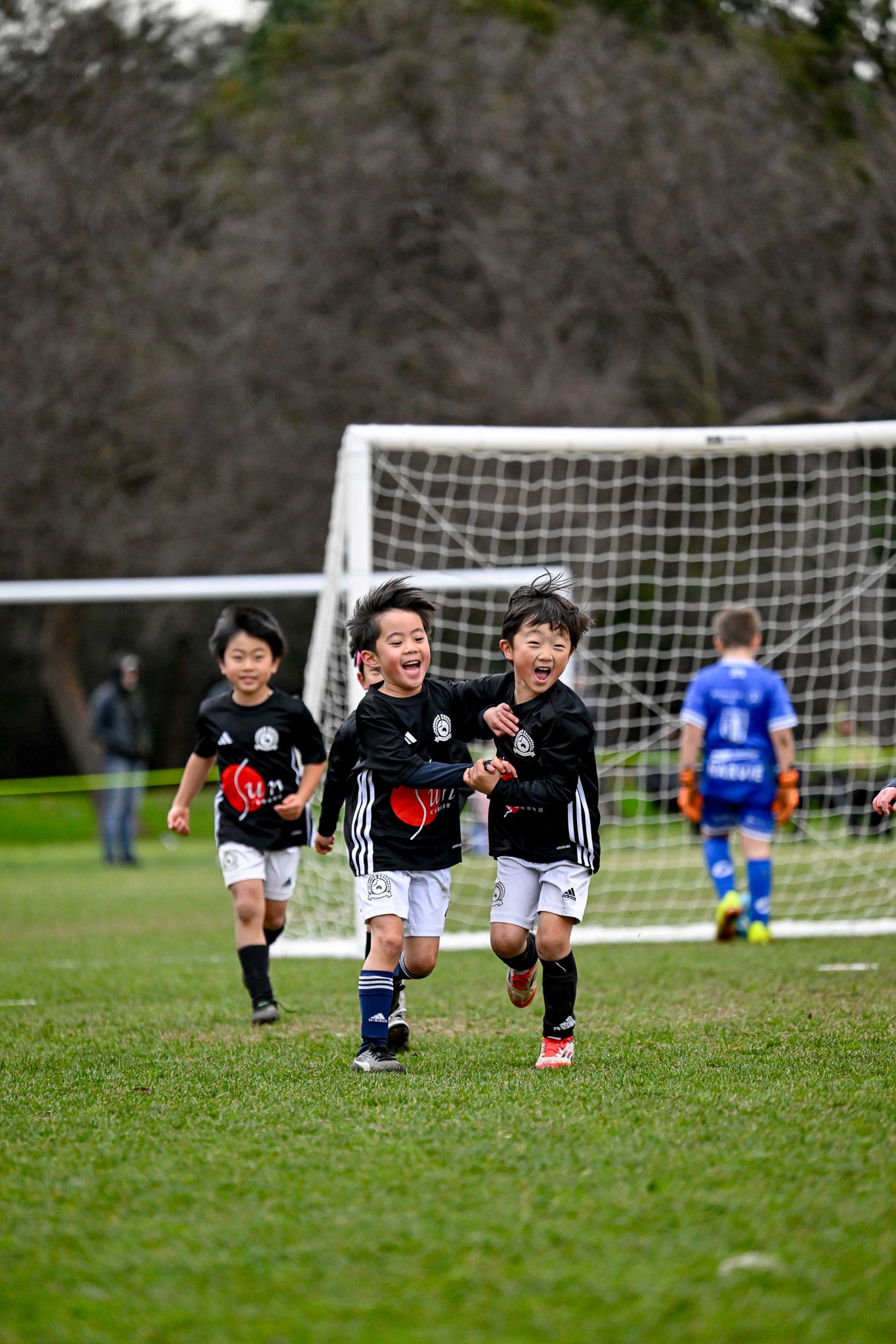 Photo of rows of books in a library with marble busts.